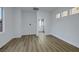 Bright bedroom with hardwood floors, neutral walls, and ensuite bathroom at 2873 Knoxville Ct, Henderson, NV 89052