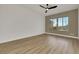 Spacious bedroom with modern fan, neutral color walls, and wood floors at 2873 Knoxville Ct, Henderson, NV 89052