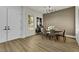 Bright dining room with LVP flooring and modern lighting at 2873 Knoxville Ct, Henderson, NV 89052