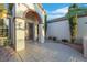 Inviting front entrance with a covered porch, decorative door, and neatly landscaped garden at 2873 Knoxville Ct, Henderson, NV 89052