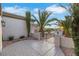 Charming home exterior featuring desert landscaping, stone walkway, and a gated entrance at 2873 Knoxville Ct, Henderson, NV 89052