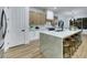 Modern kitchen featuring a large island with seating and a stainless steel refrigerator at 2873 Knoxville Ct, Henderson, NV 89052