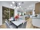 Modern kitchen with marble island and countertops, stainless steel appliances and open floorplan at 2873 Knoxville Ct, Henderson, NV 89052