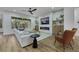 Bright living room featuring an electric fireplace, large sofa, and big windows at 2873 Knoxville Ct, Henderson, NV 89052