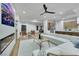 Open living room flows into the kitchen, featuring a fireplace and big island at 2873 Knoxville Ct, Henderson, NV 89052