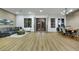 Open-concept living space features a modern design with hardwood floors, ample seating, and dining area at 2873 Knoxville Ct, Henderson, NV 89052