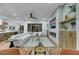 Bright living room with large windows, modern furniture, and an entertainment center with fireplace at 2873 Knoxville Ct, Henderson, NV 89052