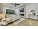 The main bedroom features a fireplace, television, sitting area, and exterior views at 2873 Knoxville Ct, Henderson, NV 89052
