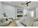This main bedroom features a fireplace, television, ceiling fan, and sitting area at 2873 Knoxville Ct, Henderson, NV 89052