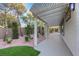 An inviting outdoor space featuring a covered patio with a pergola and well-manicured landscaping at 2873 Knoxville Ct, Henderson, NV 89052