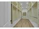 Spacious walk-in closet featuring ample shelving and storage options and wood floors at 2873 Knoxville Ct, Henderson, NV 89052