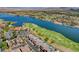 Aerial of community featuring a lake, golf course, and luxury homes at 3 Hilltop Crest St, Henderson, NV 89011
