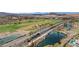 Overhead shot of the golf course and pond area, with homes in the background at 3 Hilltop Crest St, Henderson, NV 89011