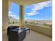 Spacious balcony features patio seating and panoramic views of the surrounding landscape at 3 Hilltop Crest St, Henderson, NV 89011