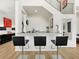 Contemporary bar area with stainless steel accents, granite countertop, and stylish black bar stools at 3 Hilltop Crest St, Henderson, NV 89011