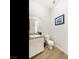 Half bath featuring a modern sink, granite countertop, and tile flooring at 3 Hilltop Crest St, Henderson, NV 89011