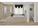 Luxurious bathroom featuring a standalone tub, shower, and modern fixtures at 3 Hilltop Crest St, Henderson, NV 89011