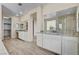 Bathroom featuring dual sinks with granite counters and walk-in tiled shower at 3 Hilltop Crest St, Henderson, NV 89011