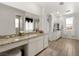 Bright bathroom with dual vanities, soaking tub, and walk-in shower at 3 Hilltop Crest St, Henderson, NV 89011