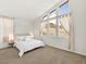 Bright bedroom with large windows showcasing desert landscape and comfortable carpet at 3 Hilltop Crest St, Henderson, NV 89011