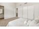 Bedroom featuring neutral carpet, walk in closet, and entrance to the bathroom at 3 Hilltop Crest St, Henderson, NV 89011