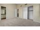 Comfortable bedroom featuring plush carpeting, closet space, and an ensuite bathroom at 3 Hilltop Crest St, Henderson, NV 89011