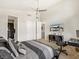 Bedroom featuring neutral colors, a ceiling fan, television, and a desk space at 3 Hilltop Crest St, Henderson, NV 89011