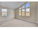 Serene bedroom featuring large windows with beautiful mountain views and plush carpeting at 3 Hilltop Crest St, Henderson, NV 89011