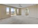 Large bedroom with mountain view through sliding doors to balcony, en-suite bathroom access at 3 Hilltop Crest St, Henderson, NV 89011