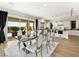Bright dining area features an elegant table set and sliding glass doors to the outdoor space at 3 Hilltop Crest St, Henderson, NV 89011