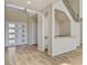 Welcoming entryway with wood-look tile flooring and a modern front door with decorative glass panels at 3 Hilltop Crest St, Henderson, NV 89011