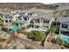 Beautiful home exterior with a well-manicured yard, featuring a sparkling swimming pool and patio area at 3 Hilltop Crest St, Henderson, NV 89011