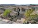 Beautifully landscaped home with a brick driveway and a two-car garage at 3 Hilltop Crest St, Henderson, NV 89011