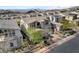 Beautifully landscaped home with a brick driveway and a two-car garage at 3 Hilltop Crest St, Henderson, NV 89011