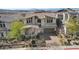 Beautifully landscaped home with a brick driveway and a two-car garage at 3 Hilltop Crest St, Henderson, NV 89011