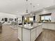 Bright open concept layout with modern kitchen and dining area, with access to the living room at 3 Hilltop Crest St, Henderson, NV 89011