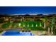 Backyard pool overlooking the city and mountains, creating a tranquil and picturesque setting for relaxation at 3 Hilltop Crest St, Henderson, NV 89011