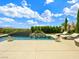 Backyard pool with water feature, landscaping, and comfortable lounge chairs at 3 Hilltop Crest St, Henderson, NV 89011
