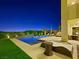 Lounge by a modern pool with desert landscape and patio furniture offering a serene outdoor living space at 3 Hilltop Crest St, Henderson, NV 89011
