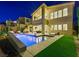Inviting backyard oasis with a sparkling pool, ample seating, and lush landscaping for ultimate outdoor enjoyment at 3 Hilltop Crest St, Henderson, NV 89011