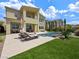 Beautiful backyard featuring a refreshing pool, comfortable lounge seating, and patio area at 3 Hilltop Crest St, Henderson, NV 89011