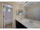Bathroom with double sink vanity, large mirror and separate tub shower at 3034 Scenic Valley Way, Henderson, NV 89052