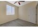 Bedroom featuring laminate floors, neutral paint, and a window with blinds at 3034 Scenic Valley Way, Henderson, NV 89052