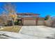 Charming two-story home featuring a well-manicured lawn and a spacious three-car garage at 3034 Scenic Valley Way, Henderson, NV 89052