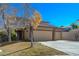 Beautiful two-story home boasting a lush front yard and a convenient three-car garage at 3034 Scenic Valley Way, Henderson, NV 89052