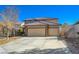 Home featuring a three car garage, well-maintained landscaping, and tile roof at 3034 Scenic Valley Way, Henderson, NV 89052