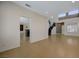 Expansive living area with tile flooring leading to kitchen and foyer, showcasing an open layout at 3034 Scenic Valley Way, Henderson, NV 89052