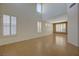 Bright, open living room with soaring ceilings and large windows with shutter-style window coverings at 3034 Scenic Valley Way, Henderson, NV 89052