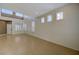 Bright living room featuring tile floors, a soaring ceiling, and clerestory windows at 3034 Scenic Valley Way, Henderson, NV 89052