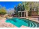 Backyard view of the private pool, lounge area and mature trees at 3034 Scenic Valley Way, Henderson, NV 89052